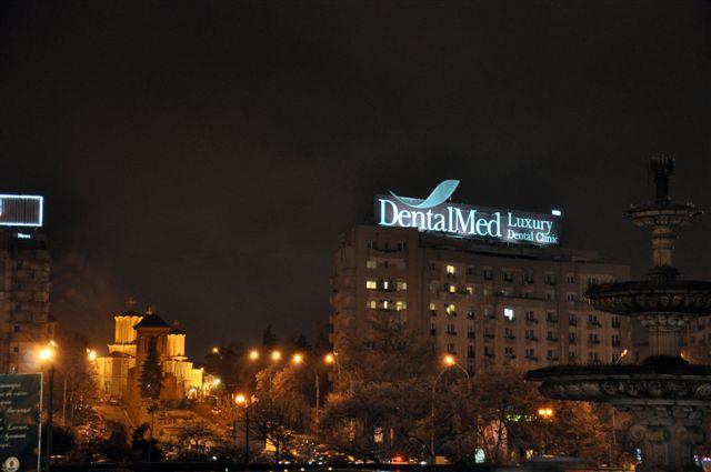 Roof DentalMed Unirea Square at Night